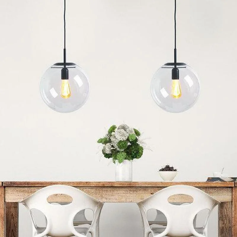 Industrial Style Ceiling Lights with Exposed Bulbs and Metal CagesContemporary Glass Pendant in Brass or Black Medium Sized Industrial Style Ceiling Lights with Exposed Bulbs and Metal CagesContemporary Glass Pendant in Brass or Black Medium Sized